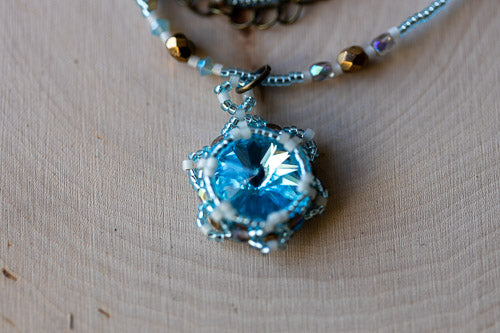 Handwoven Lotus Flower Necklace | Aqua Blue Crystal & Brass Em'z Blendz Soap Co.