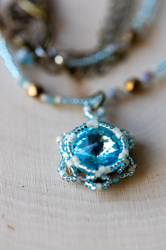 Handwoven Lotus Flower Necklace | Aqua Blue Crystal & Brass Em'z Blendz Soap Co.